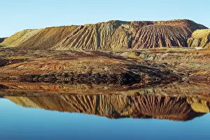 Mines: Dramatic landscape of mineral-rich ground and rock sca