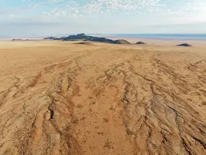 Eroded: Dried-up river beds and isolated mountain ridges at the edge of the Namib Desert