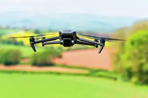 Devon: Drone in flight over fields and farms, Devon, England
