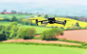 Devon: Drone in flight over fields and farms, Devon, England