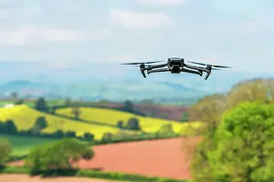 Devon: Drone in flight over fields and farms, Devon, England