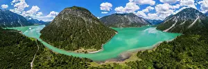 Surrounded: Drone shot, emerald green Lake Plansee surrounded