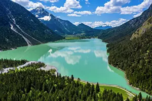 Surrounded: Drone shot, emerald green Lake Plansee surrounded