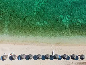 Croatia: Drone shot, sunshades on the beach with turquoise