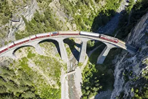 Track: Drone shot of train passing the Landwasserviadukt