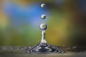 Planet: Drops of water with the reflection of the map of