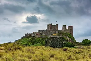 Bamburgh: Dune landscape with Bamburgh Castle under a cloudy