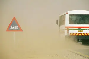 Sandstorm: DUST / SAND STORM - 'SandI road sign and bus