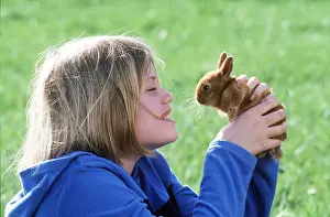 Owner: DWARF RABBIT HELD UP BY GIRL