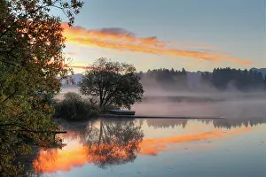 Dawning: Early morning mood at Huttlerweiher, community of