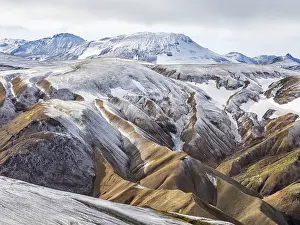 Early: Early snow on the colorful rhyolite mountains