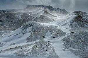 Snowfall: Early spring snowfall on the mountains around th