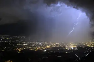 Liquid: Eclair in the rain curtain of a storm above the