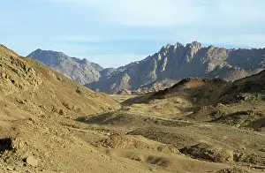 Winds: Egypt - a road winds through rocks in Arabian desert