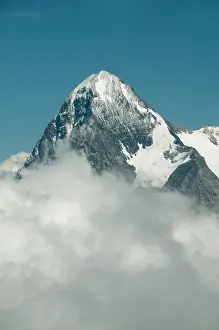 Eiger: Eiger (3970 m) rising above clouds from