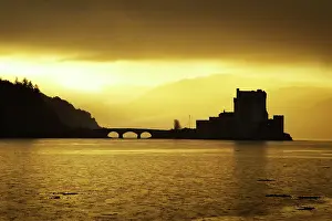 Lochs: Eilean Donan Castle - being silhouetted in atmospheric