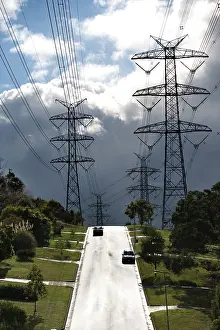 Marching: Electricity pylons marching down a suburban street