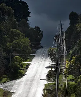 Marching: Electricity pylons marching down a suburban street