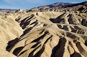 Gower: Eroded badlands at Gower Gulch seen from Zabriskie Point