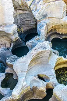 Potholes: Eroded sandstone potholes in Bourke's Luck Potholes