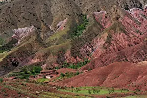Local: Erosion landscape with small clay village of the