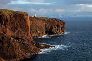 Ness: Esha Ness cliffs and lighthouse along cliffs edge