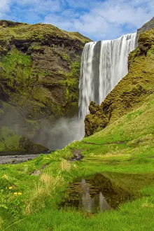 Skogafoss: Europe, Iceland, Skogafoss. Waterfall reflects