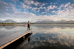 Bodies: Evening mood at Hopfensee Lake with an angler and