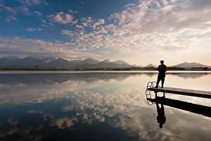 Bodies: Evening mood at Hopfensee Lake with an angler and