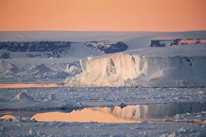Mirror: Evening mood in the sea ice with iceberg and reflection