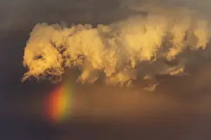 Rainbows: Evening thunderstorm with Cumulonimbus cloud and