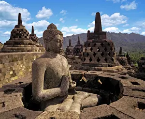 Monuments: Exposed Buddha statue in the temple complex of Borobudur