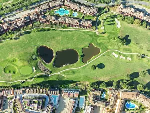 Housing: Fairway framed by housing estates at the Islantilla