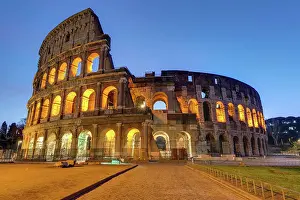 Daybreak: The famous Colosseum in Rome illuminated at dusk