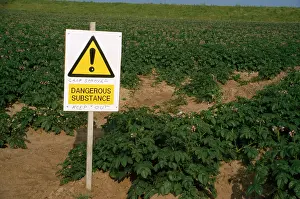 Chemicals: Farming - sign warning to keep out of field. Crops