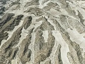 Isolation: Farmland amongst rocky outcrops. Aerial view. Drone