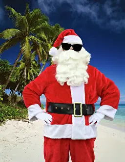 Jean-marc La Roque: Father Christmas, on the beach with palm trees wearing