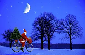 Bikes: Father Christmas - on bicycle cycling past trees