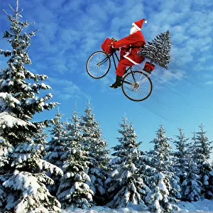 Bikes: Father Christmas - on bicycle flying through the air