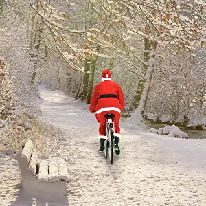 Bikes: Father Christmas - cycling through frosty Winter Scene