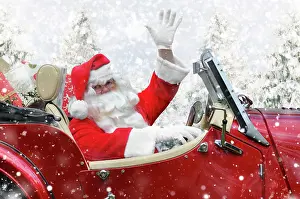Delivering: Father Christmas driving a sports car through winter scene