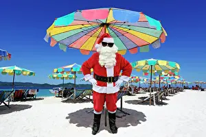 Umbrellas: Father Christmas / Santa Claus on beach, Khai Nai