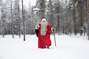 Sack: Father Christmas / Santa waking through snow landscape w