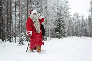 Sack: Father Christmas / Santa waking through snow landscape w