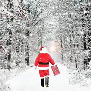 Father Christmas, walking through winter snow scene