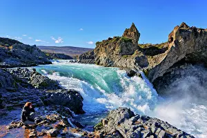 Northeastern: Female tourist at waterfall Godafoss, Laugar, Fossh&, xecb29;