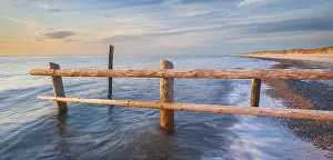 Border: Fence on the beach of the Baltic Sea as the border of the