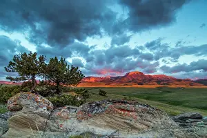 Choteau: Fiery sunrise light strikes Ear Mountain