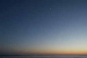 Wadden: First Quarter Moon over the Wadden Sea