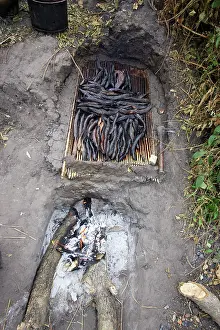 Cooked: Fish - being cooked over fire
